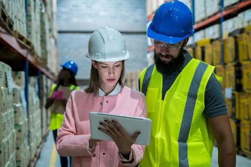 stock image of two quality managers using Job Safety Analysis